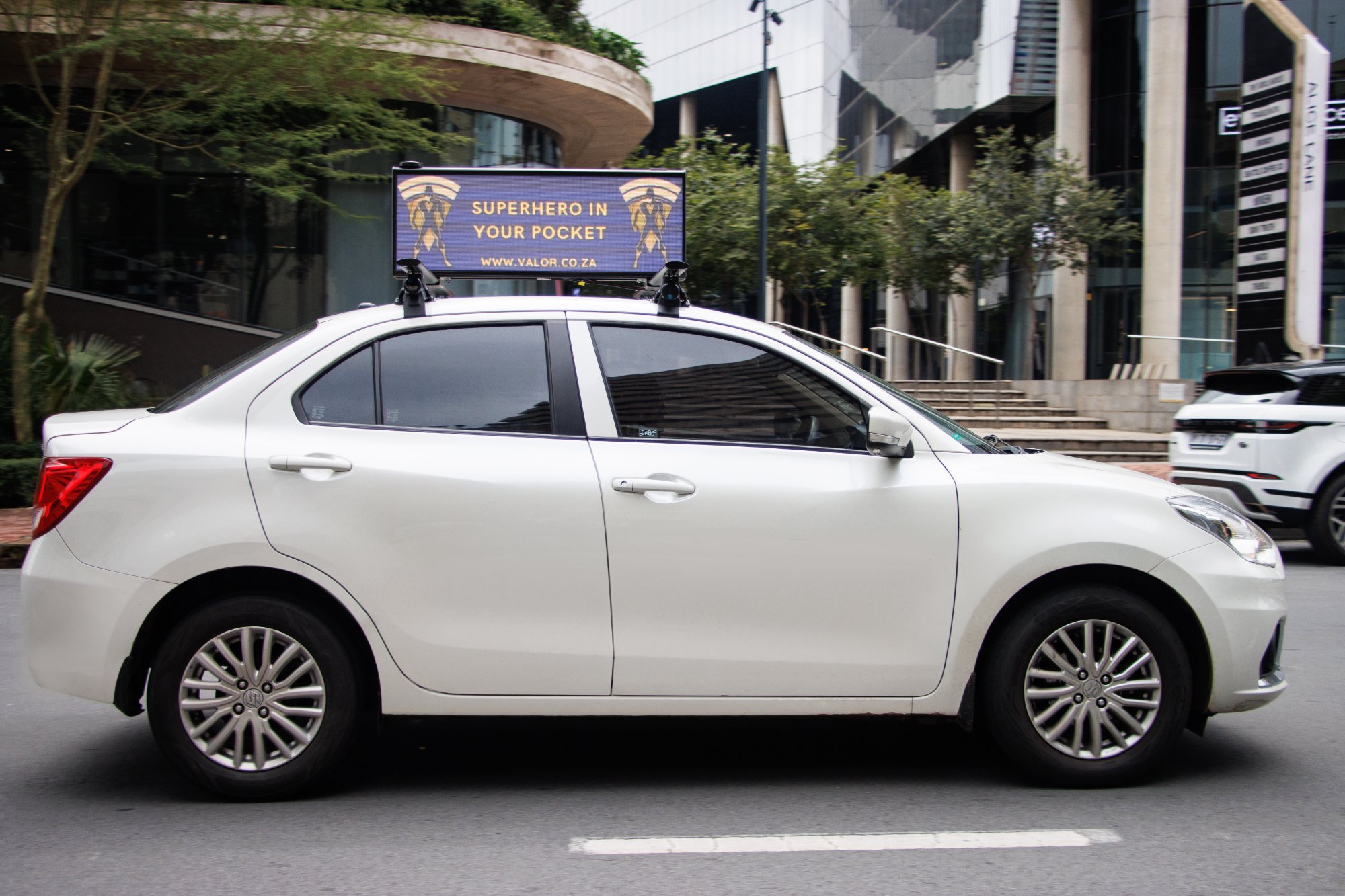ROHM Media cartop screen with advertise here message in Sandton parking